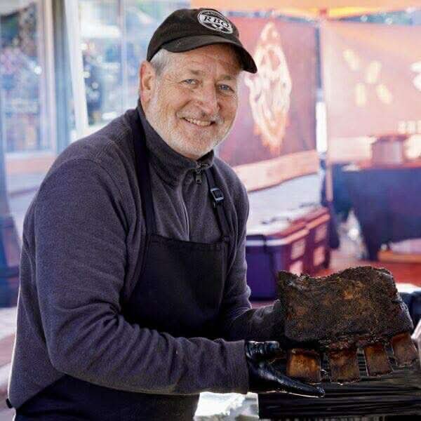 Roger holding beef ribs